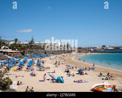 Playa Blanca, Spain; March 26th 2022: Playa Dorada beach in Playa Blanca, Lanzarote, Canary Islands Stock Photo