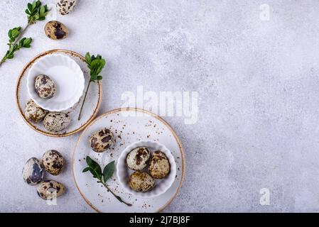 Bowl with quail eggs on light background Stock Photo