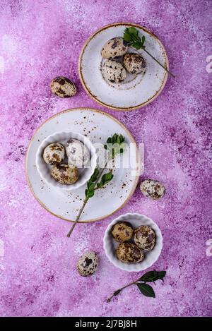 Bowl with quail eggs on light background Stock Photo