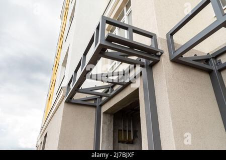 metal frame structure of the canopy over the entrance to the house, selective focus Stock Photo