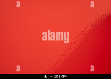Red leather texture with stitching on an S form Stock Photo