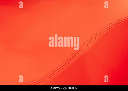 Red leather texture with stitching on an S form Stock Photo