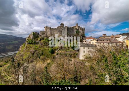 The ancient castle of Bardi, Parma, Italy, under a dramatic sky Stock Photo