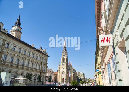 Novi Sad, Serbia - 06.05.2021: Closeup of H and M sign on modern building facade in the street Stock Photo