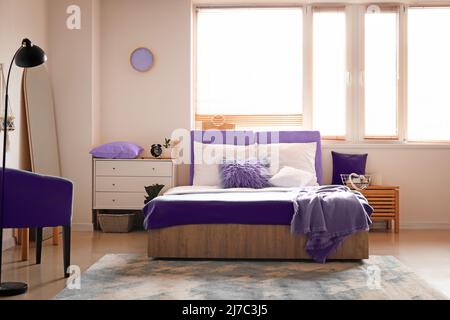 Interior of stylish bedroom with big window Stock Photo