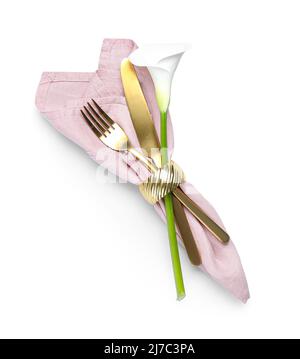 Golden cutlery and beautiful calla lily on white background Stock Photo