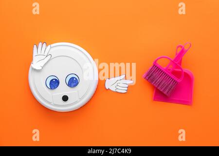 Modern robot vacuum cleaner with drawn eyes, broom and dustpan on color background Stock Photo
