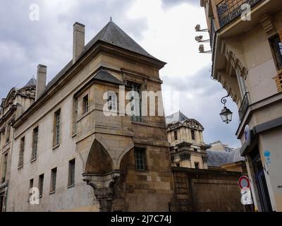 Interesting architecture of old buildings and narrow streets at the corner of rue Pavée and rue des Francs Bourgeois, lower Marais, Paris, France. Stock Photo