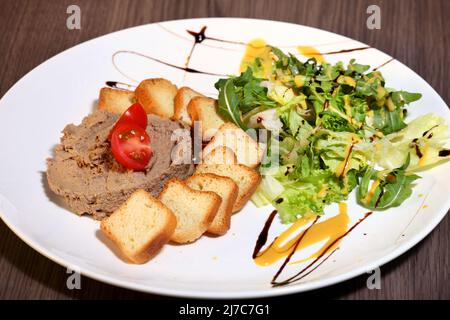 Canapes with salmon red caviar on a wooden background Stock Photo