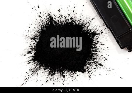 Black toner for a laser printer on a white background. Toner powder isolate. Cartridge Stock Photo