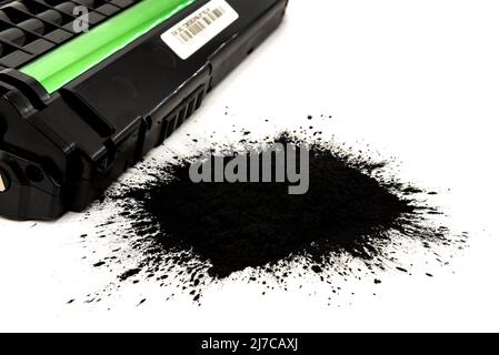 Black toner for a laser printer on a white background. Toner powder isolate. Cartridge Stock Photo