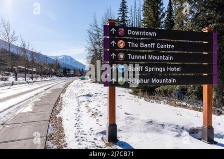 Banff, Alberta, Canada - March 6 2022 : Town of Banff street signpost. Banff National Park winter time. Canadian Rockies. Stock Photo