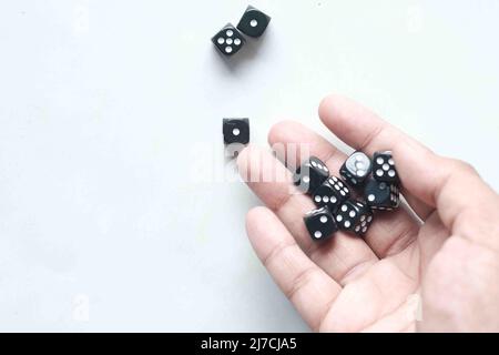 Black Dice trowing on white background top view  Stock Photo