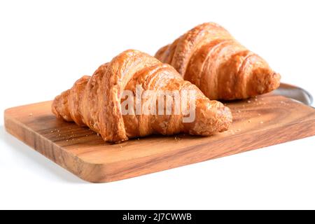 Homemade croissant on wood plate and isolated on white background, bakery concept Stock Photo