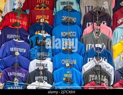 Football jerseys with names of football players for sale at sales stall,  Florence, Italy Stock Photo - Alamy