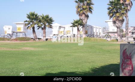 Picnic area and lifeguard stand or life guard tower for surfing, California beach. Rescue hut or lifesavers station, public park recreation place for barbecue. Bbq hot coals only, Mission beach, USA. Stock Photo