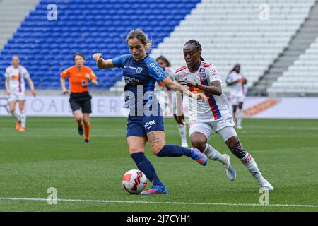 Lyon, France. 08/05/2022, Tess Laplacette (7 Paris FC) protects the ball from Melvine Malard (28 Lyon) during the D1 Arkema match between Olympique Lyonnais and Paris FC at Groupama Stadium in Lyon, France.  Lyubomir Domozetski/SPP Stock Photo