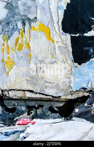 Torn posters creating a décollage effect, London, UK. Stock Photo