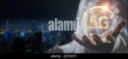 Hand business man show global network connection 5G. Global network connection 5G with icon concept Technology network wireless systems and internet o Stock Photo