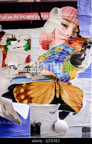 Torn posters creating a décollage effect, London, Uk. Stock Photo