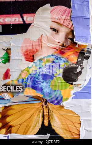 Torn posters creating a décollage effect, London, Uk. Stock Photo