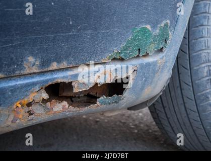 Decayed threshold and a fragment of a car door Stock Photo