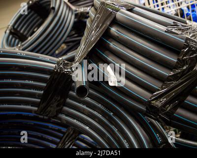 Voronezh, Russia - July 11, 2021: Coil HDPE pipes for water on sale Stock Photo