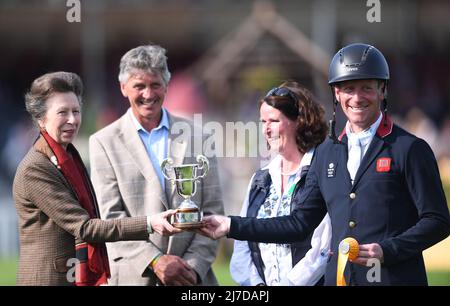 8th May 2022, Badminton Estate, Gloucestershire, England; Mars Equestrian Badminton Horse Trials, day 5;  Oliver Townend receives the third place trophy from HRH Princess Anne Stock Photo