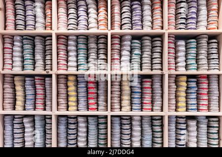 Bayonne in France, colorful espadrilles stored on a shelf Stock Photo