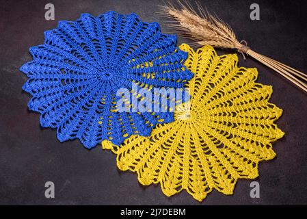 A few things tied from strings with your own hands in the colors of the  flag of Ukraine. Save the lives of the children of Ukraine Stock Photo -  Alamy