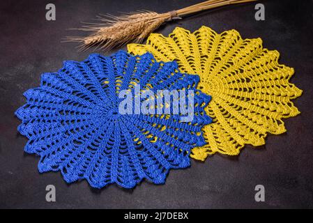 A few things tied from strings with your own hands in the colors of the  flag of Ukraine. Save the lives of the children of Ukraine Stock Photo -  Alamy