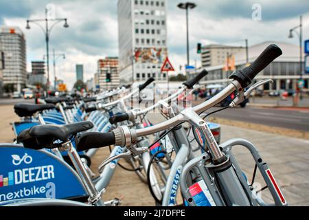 Bicycles for rent, in the parking lot. Berlin, Germany - 05.17.2019 Stock Photo