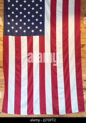 American flag hanging on a wooden wall Stock Photo