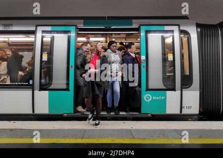 Paris, France - November 09, 2018: Commuters in a crowded metro train in the Paris metro. Stock Photo