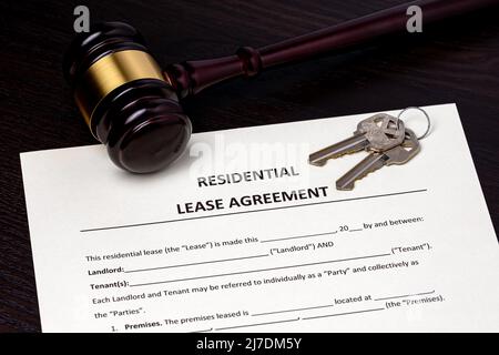 Residential lease agreement contract and gavel. Real estate law and rental dispute concept Stock Photo