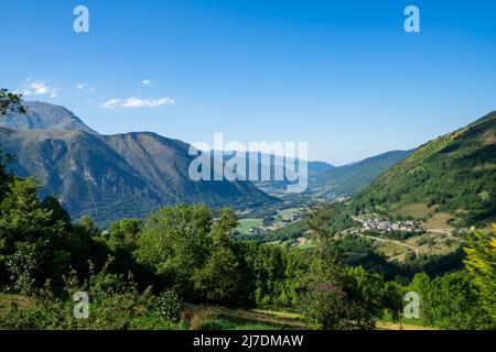 view of valley Aure in the french pyrenees mountains on a cloudy day with typical pyrenean village in altitude Stock Photo