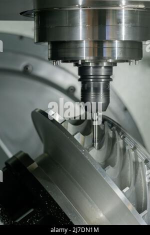 Close up: cnc turning milling machine cutting metal workpiece at ...