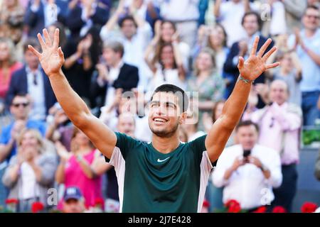 Madrid, Spain - 8 May 2022 Carlos Alcaraz Garfia of Spain celebrates after winning the men's Mutua Madrid Open after his victory in the men's final match at La Caja Magica in Madrid. Carlos Alcaraz defeats Alexander Zverev in the end (6-3,6-1) Stock Photo