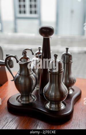 A tin pepper jar displayed on the shop window of FAEMAM store in Sao Joao del Rei historical center. Stock Photo