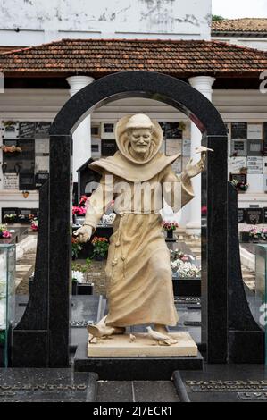 The statue of Francis of Assisi at the tombs of Tancredo Neves and his wife Risoleta Tolentino inside Sao Francisco de Assis church cemetery. Stock Photo