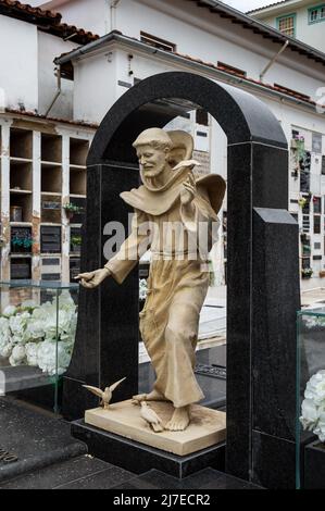 The statue of Francis of Assisi at the tombs of Tancredo Neves and his wife Risoleta Tolentino inside Sao Francisco de Assis church cemetery. Stock Photo