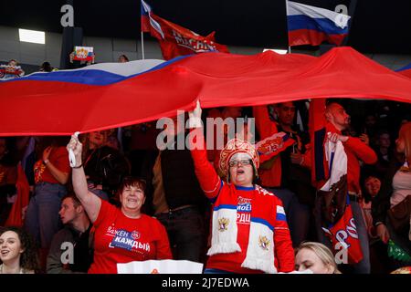Saint Petersburg, Russia - 8 May 2022, Fans hold the flag of Russia during the Liga Stavok St. Petersburg Cup, hockey tournament final match between Russia and Belarus at Jubilee Arena in Saint Petersburg. (Final score; Russia 3:2 Belarus). Stock Photo