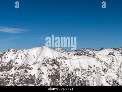 Mountain peaks covered with snow in winter. Mountain range in Caucasus region in Russia Stock Photo