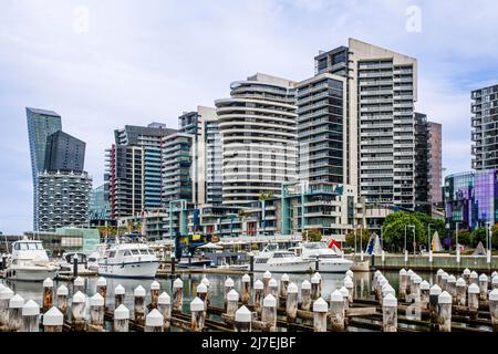 Yachts moored in front of skyscrapers in Docklands area of Melbourne, Victoria, Australia on Friday, April 15, 2022.Photo: David Rowland / One-Image.c Stock Photo
