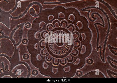 Chocolate background with a beautiful pattern. Macro view of the chocolate background Stock Photo