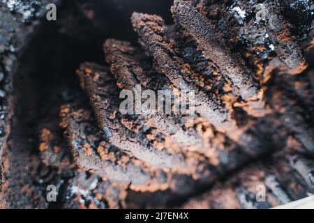 Resin and soot on the fins of a solid fuel boiler after the heating season close-up Stock Photo