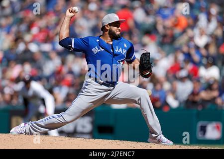 CLEVELAND, OH - MAY 7: Toronto Blue Jays relief pitcher Trent Thornton (57)  hands the ball to manager Charlie Montoyo (25) as he leaves a game against  the Cleveland Guardians at Progressive