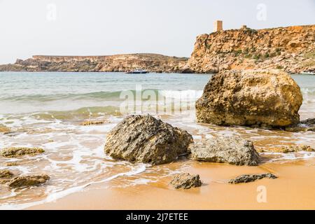 Rocks on the orange beach of Ghajn Tuffieha in the North West of Malta. Stock Photo