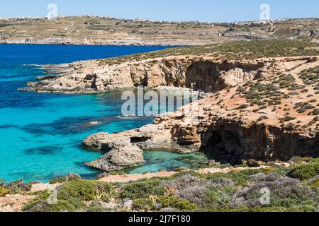 Rugged coastline of Comino seen from a high vantage point in April 2022. Stock Photo