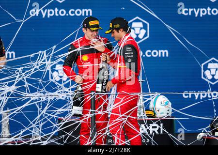 Charles Leclerc of Scuderia Ferrari celebrates victory with the trophy ...